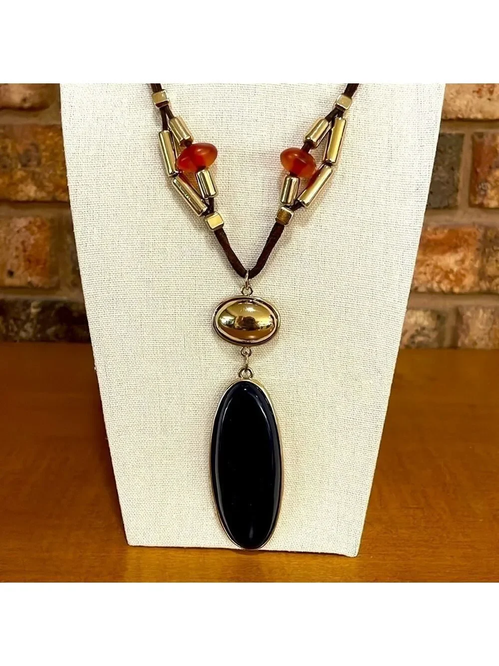 Chico’s leather long beaded necklace with gold and navy blue pendant